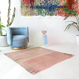Vintage kilim rug in living room setting, old rug, antique rug, pastel colors, faded colors, Turkish rug, vintage rug, soft rug, Portland, Oregon, rug store, rug shop, local shop, earthy tones, earthy colors, warm colors