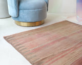 Vintage kilim rug in living room setting, old rug, antique rug, pastel colors, faded colors, Turkish rug, vintage rug, soft rug, Portland, Oregon, rug store, rug shop, local shop, earthy tones, earthy colors, warm colors