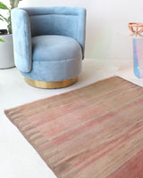 Vintage kilim rug in living room setting, old rug, antique rug, pastel colors, faded colors, Turkish rug, vintage rug, soft rug, Portland, Oregon, rug store, rug shop, local shop, earthy tones, earthy colors, warm colors