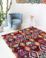 Vintage kilim rug in living room setting, bright colors, wild shaman, soft rug, bold color, Portland, Oregon, rug store, rug shop, local shop, vintage rug, modern kilim, warm colors
