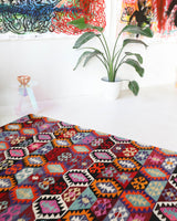 Vintage kilim rug in living room setting, bright colors, wild shaman, soft rug, bold color, Portland, Oregon, rug store, rug shop, local shop, vintage rug, modern kilim, warm colors