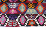 Vintage kilim rug in living room setting, bright colors, wild shaman, soft rug, bold color, Portland, Oregon, rug store, rug shop, local shop, vintage rug, modern kilim, warm colors