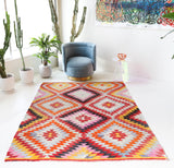 Vintage kilim rug in room decor setting, old rug, antique rug, pastel colors, faded colors, Turkish rug, vintage rug, soft rug, Portland, Oregon, rug store, rug shop, local shop,  antique kilim rug, bold colors, bright colors, faded colors