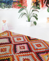 Vintage kilim rug in room decor setting, old rug, antique rug, pastel colors, faded colors, Turkish rug, vintage rug, soft rug, Portland, Oregon, rug store, rug shop, local shop,  antique kilim rug, bold colors, bright colors, faded colors