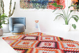 Vintage kilim rug in room decor setting, old rug, antique rug, pastel colors, faded colors, Turkish rug, vintage rug, soft rug, Portland, Oregon, rug store, rug shop, local shop,  antique kilim rug, bold colors, bright colors, faded colors
