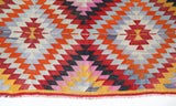 Vintage kilim rug in room decor setting, old rug, antique rug, pastel colors, faded colors, Turkish rug, vintage rug, soft rug, Portland, Oregon, rug store, rug shop, local shop,  antique kilim rug, bold colors, bright colors, faded colors