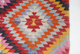 Vintage kilim rug in room decor setting, old rug, antique rug, pastel colors, faded colors, Turkish rug, vintage rug, soft rug, Portland, Oregon, rug store, rug shop, local shop,  antique kilim rug, bold colors, bright colors, faded colors