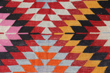 Vintage kilim rug in room decor setting, old rug, antique rug, pastel colors, faded colors, Turkish rug, vintage rug, soft rug, Portland, Oregon, rug store, rug shop, local shop,  antique kilim rug, bold colors, bright colors, faded colors
