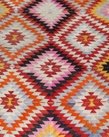 Vintage kilim rug in room decor setting, old rug, antique rug, pastel colors, faded colors, Turkish rug, vintage rug, soft rug, Portland, Oregon, rug store, rug shop, local shop,  antique kilim rug, bold colors, bright colors, faded colors