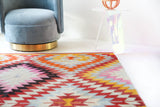 Vintage kilim rug in room decor setting, old rug, antique rug, pastel colors, faded colors, Turkish rug, vintage rug, soft rug, Portland, Oregon, rug store, rug shop, local shop,  antique kilim rug, bold colors, bright colors, faded colors