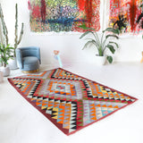 Vintage kilim rug in room decor setting, old rug, antique rug, pastel colors, faded colors, Turkish rug, vintage rug, soft rug, Portland, Oregon, rug store, rug shop, local shop,  antique kilim rug, bold colors, bright colors, faded colors