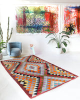 Vintage kilim rug in room decor setting, old rug, antique rug, pastel colors, faded colors, Turkish rug, vintage rug, soft rug, Portland, Oregon, rug store, rug shop, local shop,  antique kilim rug, bold colors, bright colors, faded colors