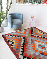 Vintage kilim rug in room decor setting, old rug, antique rug, pastel colors, faded colors, Turkish rug, vintage rug, soft rug, Portland, Oregon, rug store, rug shop, local shop,  antique kilim rug, bold colors, bright colors, faded colors