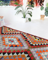 Vintage kilim rug in room decor setting, old rug, antique rug, pastel colors, faded colors, Turkish rug, vintage rug, soft rug, Portland, Oregon, rug store, rug shop, local shop,  antique kilim rug, bold colors, bright colors, faded colors