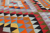 Vintage kilim rug in room decor setting, old rug, antique rug, pastel colors, faded colors, Turkish rug, vintage rug, soft rug, Portland, Oregon, rug store, rug shop, local shop,  antique kilim rug, bold colors, bright colors, faded colors