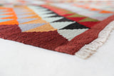 Vintage kilim rug in room decor setting, old rug, antique rug, pastel colors, faded colors, Turkish rug, vintage rug, soft rug, Portland, Oregon, rug store, rug shop, local shop,  antique kilim rug, bold colors, bright colors, faded colors