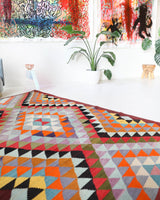 Vintage kilim rug in room decor setting, old rug, antique rug, pastel colors, faded colors, Turkish rug, vintage rug, soft rug, Portland, Oregon, rug store, rug shop, local shop,  antique kilim rug, bold colors, bright colors, faded colors