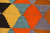 Vintage kilim rug in room decor setting, old rug, antique rug, pastel colors, faded colors, Turkish rug, vintage rug, soft rug, Portland, Oregon, rug store, rug shop, local shop,  antique kilim rug, bold colors, bright colors, faded colors