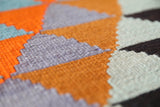 Vintage kilim rug in room decor setting, old rug, antique rug, pastel colors, faded colors, Turkish rug, vintage rug, soft rug, Portland, Oregon, rug store, rug shop, local shop,  antique kilim rug, bold colors, bright colors, faded colors