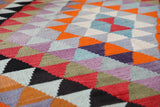 Vintage kilim rug in room decor setting, old rug, antique rug, pastel colors, faded colors, Turkish rug, vintage rug, soft rug, Portland, Oregon, rug store, rug shop, local shop,  antique kilim rug, bold colors, bright colors, faded colors