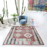 Vintage kilim rug in room decor setting, old rug, antique rug, pastel colors, faded colors, Turkish rug, vintage rug, soft rug, Portland, Oregon, rug store, rug shop, local shop,  antique kilim rug, bold colors, bright colors, faded colors