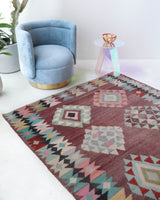Vintage kilim rug in room decor setting, old rug, antique rug, pastel colors, faded colors, Turkish rug, vintage rug, soft rug, Portland, Oregon, rug store, rug shop, local shop,  antique kilim rug, bold colors, bright colors, faded colors