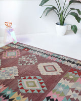 Vintage kilim rug in room decor setting, old rug, antique rug, pastel colors, faded colors, Turkish rug, vintage rug, soft rug, Portland, Oregon, rug store, rug shop, local shop,  antique kilim rug, bold colors, bright colors, faded colors