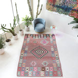 Vintage kilim rug in room decor setting, old rug, antique rug, pastel colors, faded colors, Turkish rug, vintage rug, soft rug, Portland, Oregon, rug store, rug shop, local shop,  antique kilim rug, bold colors, bright colors, faded colors