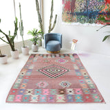 Vintage kilim rug in room decor setting, old rug, antique rug, pastel colors, faded colors, Turkish rug, vintage rug, soft rug, Portland, Oregon, rug store, rug shop, local shop,  antique kilim rug, bold colors, bright colors, faded colors