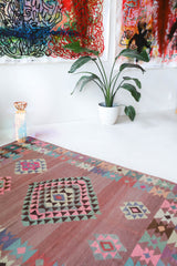 Vintage kilim rug in room decor setting, old rug, antique rug, pastel colors, faded colors, Turkish rug, vintage rug, soft rug, Portland, Oregon, rug store, rug shop, local shop,  antique kilim rug, bold colors, bright colors, faded colors