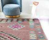 Vintage kilim rug in room decor setting, old rug, antique rug, pastel colors, faded colors, Turkish rug, vintage rug, soft rug, Portland, Oregon, rug store, rug shop, local shop,  antique kilim rug, bold colors, bright colors, faded colors