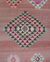 Vintage kilim rug in room decor setting, old rug, antique rug, pastel colors, faded colors, Turkish rug, vintage rug, soft rug, Portland, Oregon, rug store, rug shop, local shop,  antique kilim rug, bold colors, bright colors, faded colors