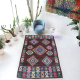 Vintage kilim rug in room decor setting, old rug, antique rug, pastel colors, faded colors, Turkish rug, vintage rug, soft rug, Portland, Oregon, rug store, rug shop, local shop,  antique kilim rug, bold colors, bright colors, faded colors