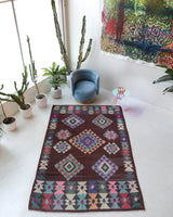 Vintage kilim rug in room decor setting, old rug, antique rug, pastel colors, faded colors, Turkish rug, vintage rug, soft rug, Portland, Oregon, rug store, rug shop, local shop,  antique kilim rug, bold colors, bright colors, faded colors