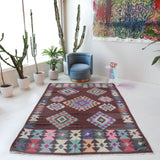 Vintage kilim rug in room decor setting, old rug, antique rug, pastel colors, faded colors, Turkish rug, vintage rug, soft rug, Portland, Oregon, rug store, rug shop, local shop,  antique kilim rug, bold colors, bright colors, faded colors