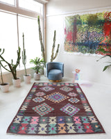 Vintage kilim rug in room decor setting, old rug, antique rug, pastel colors, faded colors, Turkish rug, vintage rug, soft rug, Portland, Oregon, rug store, rug shop, local shop,  antique kilim rug, bold colors, bright colors, faded colors