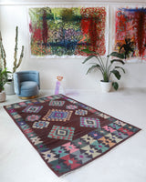 Vintage kilim rug in room decor setting, old rug, antique rug, pastel colors, faded colors, Turkish rug, vintage rug, soft rug, Portland, Oregon, rug store, rug shop, local shop,  antique kilim rug, bold colors, bright colors, faded colors