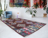 Vintage kilim rug in room decor setting, old rug, antique rug, pastel colors, faded colors, Turkish rug, vintage rug, soft rug, Portland, Oregon, rug store, rug shop, local shop,  antique kilim rug, bold colors, bright colors, faded colors