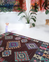Vintage kilim rug in room decor setting, old rug, antique rug, pastel colors, faded colors, Turkish rug, vintage rug, soft rug, Portland, Oregon, rug store, rug shop, local shop,  antique kilim rug, bold colors, bright colors, faded colors
