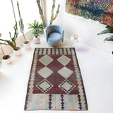 Vintage kilim rug in room decor setting, old rug, antique rug, pastel colors, faded colors, Turkish rug, vintage rug, soft rug, Portland, Oregon, rug store, rug shop, local shop,  antique kilim rug, bold colors, bright colors, faded colors