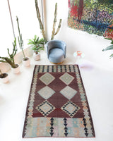 Vintage kilim rug in room decor setting, old rug, antique rug, pastel colors, faded colors, Turkish rug, vintage rug, soft rug, Portland, Oregon, rug store, rug shop, local shop,  antique kilim rug, bold colors, bright colors, faded colors