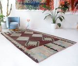 Vintage kilim rug in room decor setting, old rug, antique rug, pastel colors, faded colors, Turkish rug, vintage rug, soft rug, Portland, Oregon, rug store, rug shop, local shop,  antique kilim rug, bold colors, bright colors, faded colors