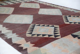 Vintage kilim rug in room decor setting, old rug, antique rug, pastel colors, faded colors, Turkish rug, vintage rug, soft rug, Portland, Oregon, rug store, rug shop, local shop,  antique kilim rug, bold colors, bright colors, faded colors