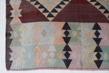 Vintage kilim rug in room decor setting, old rug, antique rug, pastel colors, faded colors, Turkish rug, vintage rug, soft rug, Portland, Oregon, rug store, rug shop, local shop,  antique kilim rug, bold colors, bright colors, faded colors