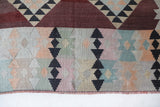 Vintage kilim rug in room decor setting, old rug, antique rug, pastel colors, faded colors, Turkish rug, vintage rug, soft rug, Portland, Oregon, rug store, rug shop, local shop,  antique kilim rug, bold colors, bright colors, faded colors
