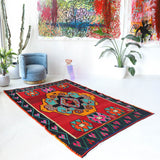 Vintage kilim rug in living room setting, bright colors, wild shaman, soft rug, bold color, Portland, Oregon, rug store, rug shop, local shop, vintage rug, modern kilim, warm colors, antique rug, antique kilim