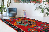 Vintage kilim rug in living room setting, bright colors, wild shaman, soft rug, bold color, Portland, Oregon, rug store, rug shop, local shop, vintage rug, modern kilim, warm colors, antique rug, antique kilim