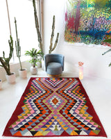Vintage kilim rug in living room setting, bright colors, wild shaman, soft rug, bold color, Portland, Oregon, rug store, rug shop, local shop, vintage rug, modern kilim, warm colors, antique rug, antique kilim