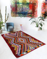 Vintage kilim rug in living room setting, bright colors, wild shaman, soft rug, bold color, Portland, Oregon, rug store, rug shop, local shop, vintage rug, modern kilim, warm colors, antique rug, antique kilim