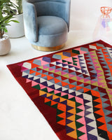 Vintage kilim rug in living room setting, bright colors, wild shaman, soft rug, bold color, Portland, Oregon, rug store, rug shop, local shop, vintage rug, modern kilim, warm colors, antique rug, antique kilim